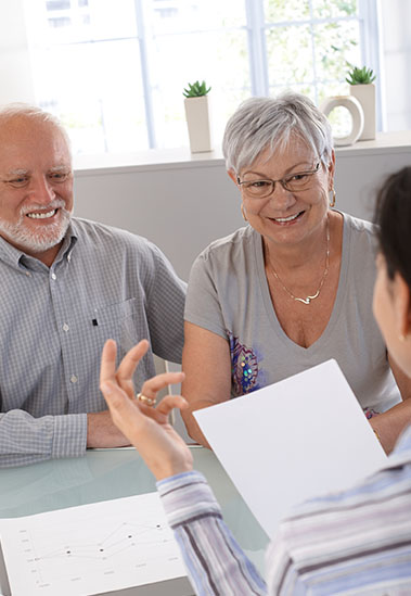 Screenshot Older couple meeting with financial advisor